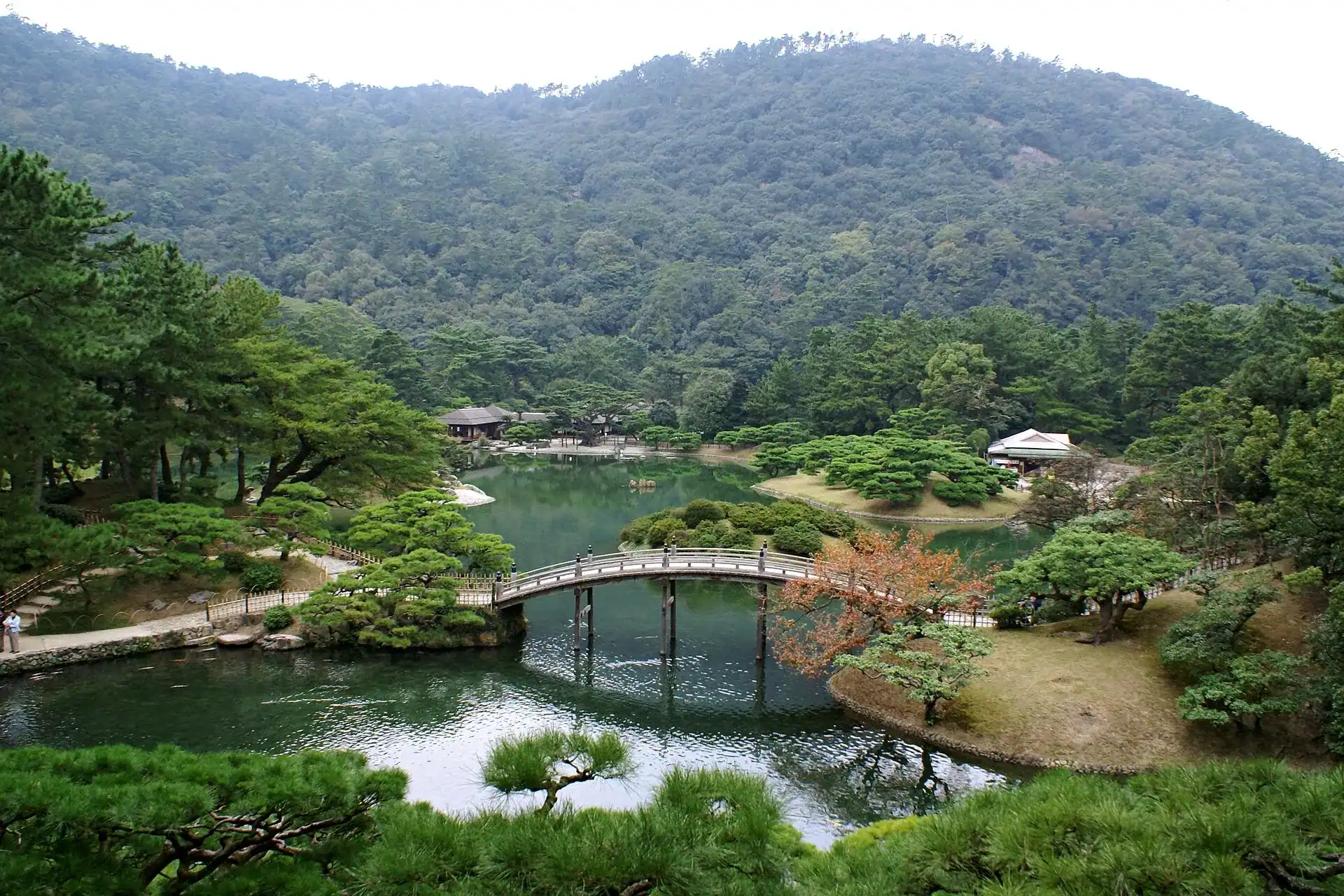 The pond and arched bridge of Ritsurin Garden at Takamatsu