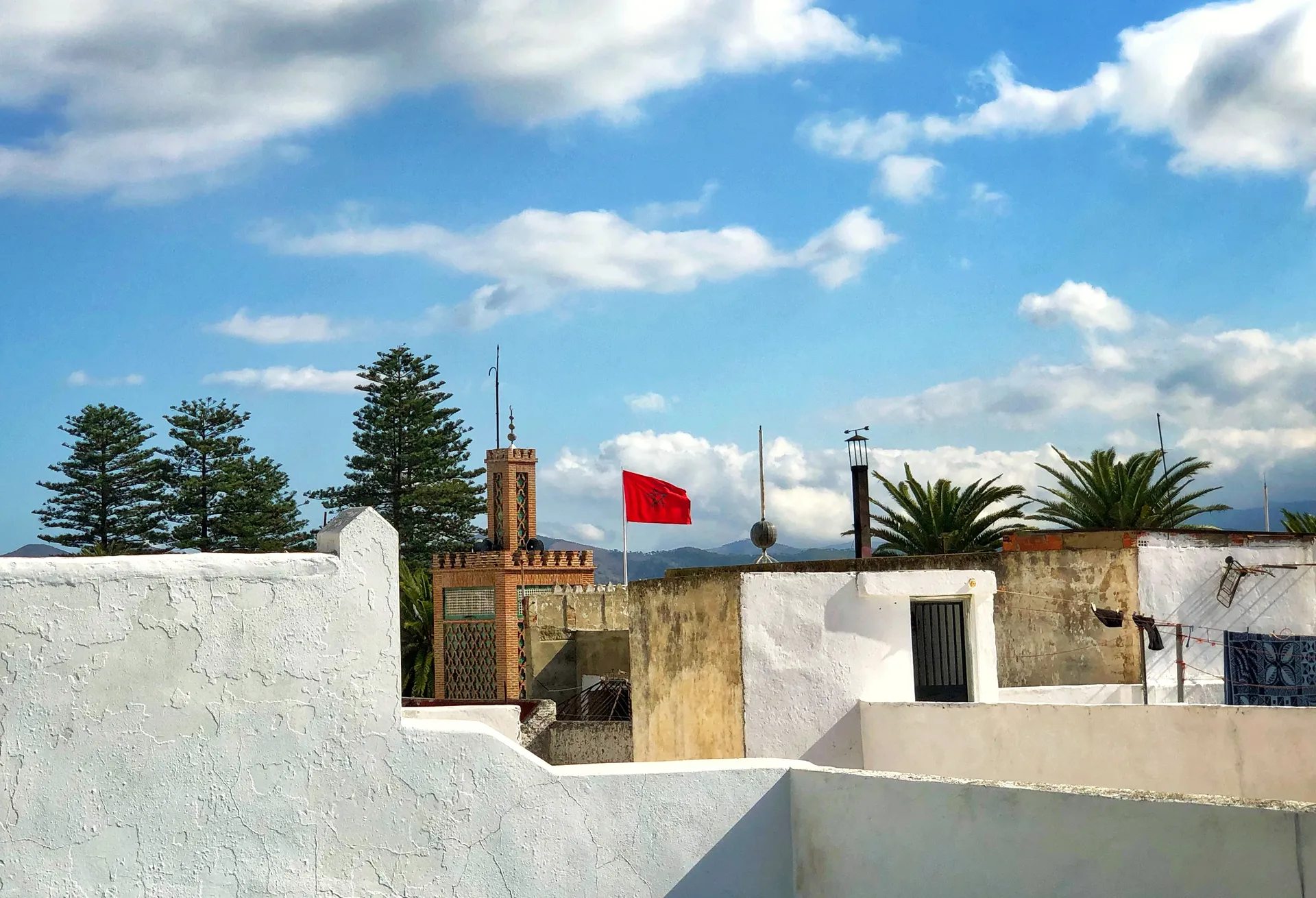 White medina rooftops and a minaret below the Rif mountains, Tetouan, Morocco
