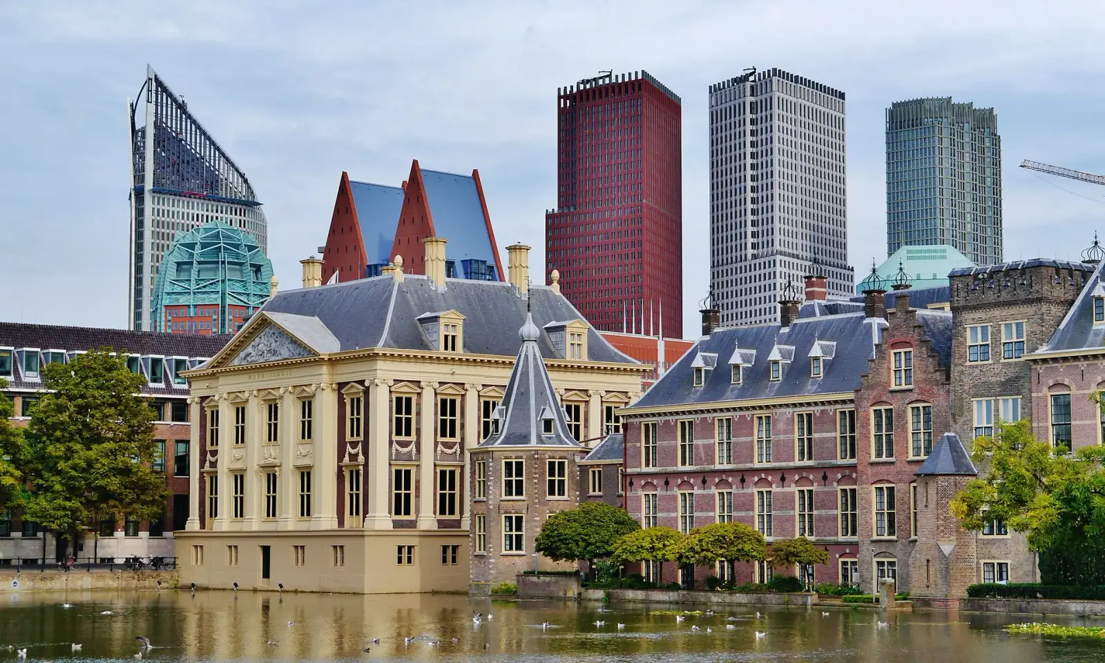 The Hague's Mauritshuis and Binnenhof over the Hofvijver with the modern skyline behind
