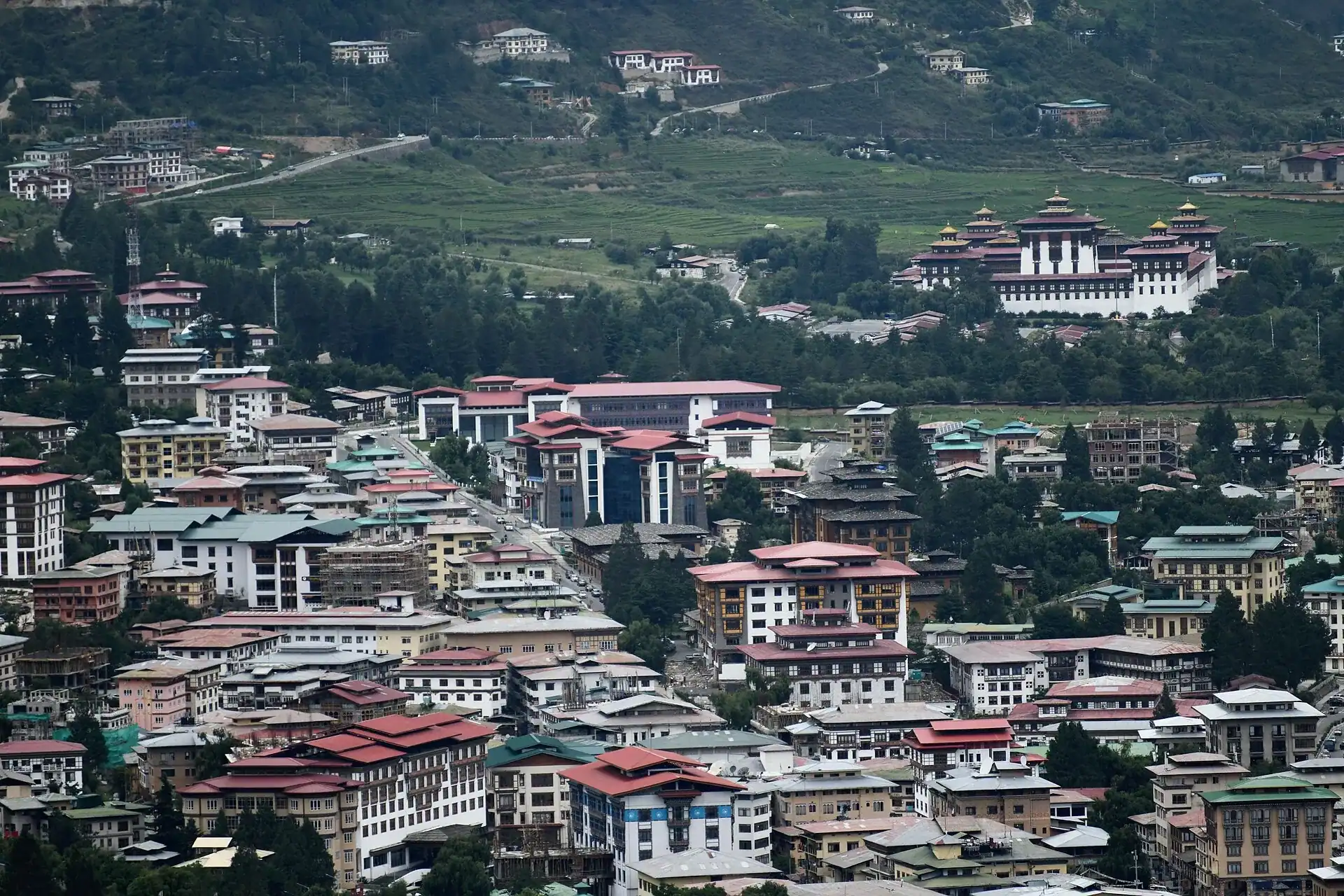 Central Thimphu in its valley, with the dzong on the slope above