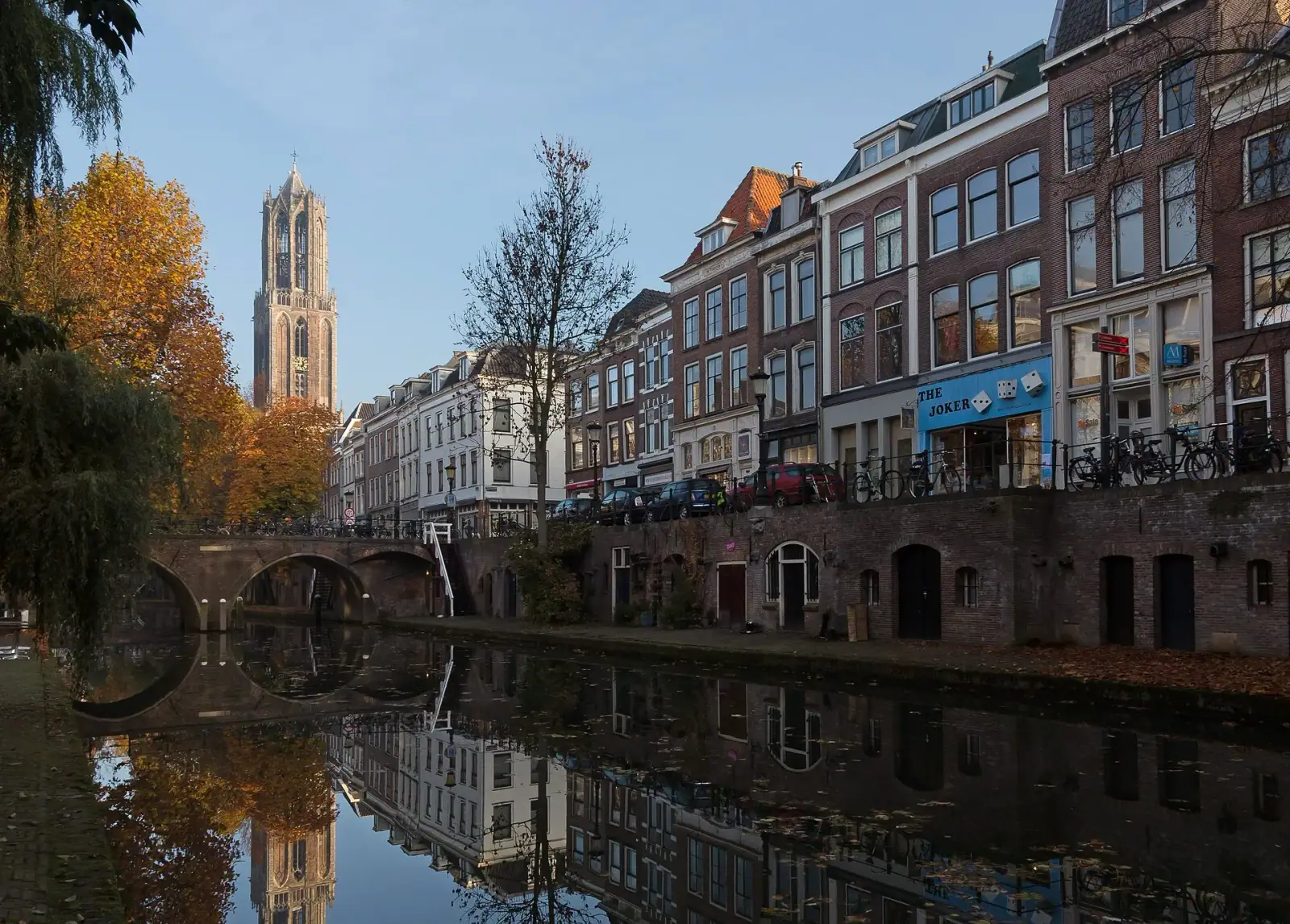 Utrecht Dom Tower rising above the Oudegracht canal in autumn