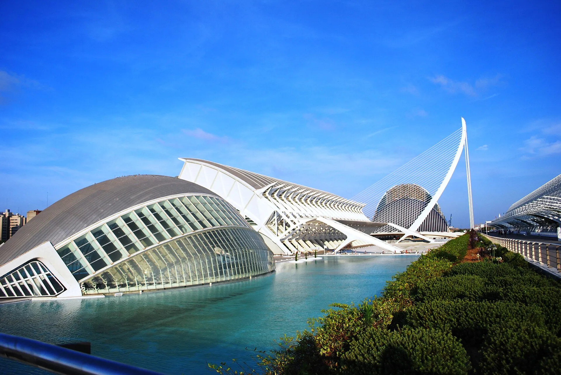City of Arts and Sciences in Valencia, Spain, with the Hemisferic dome, Museu de les Ciencies, and L'Assut de l'Or bridge reflected in the turquoise pool