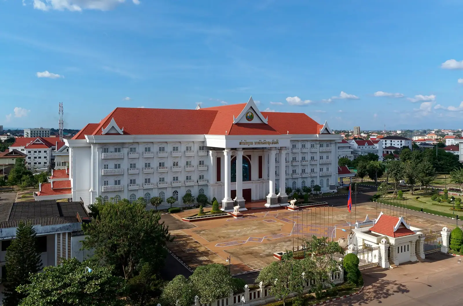 Prime Minister's Office building in Vientiane, Laos, with the city skyline behind