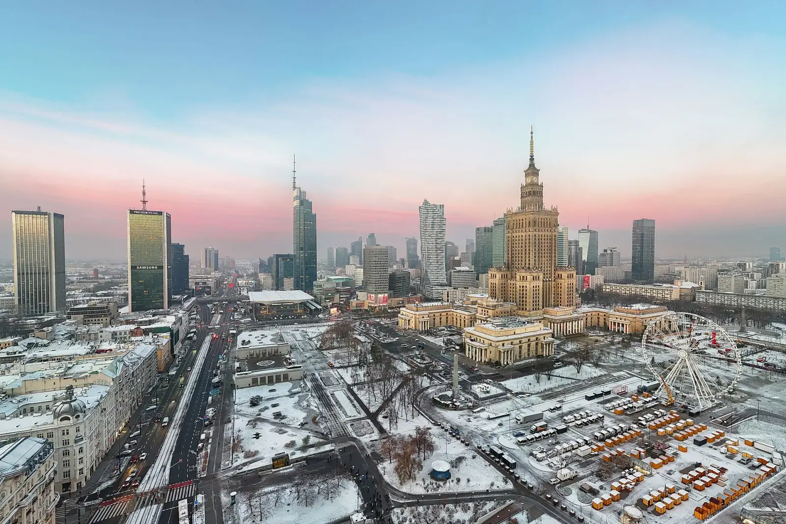 Warsaw skyline at dawn with the Palace of Culture and Science and modern skyscrapers