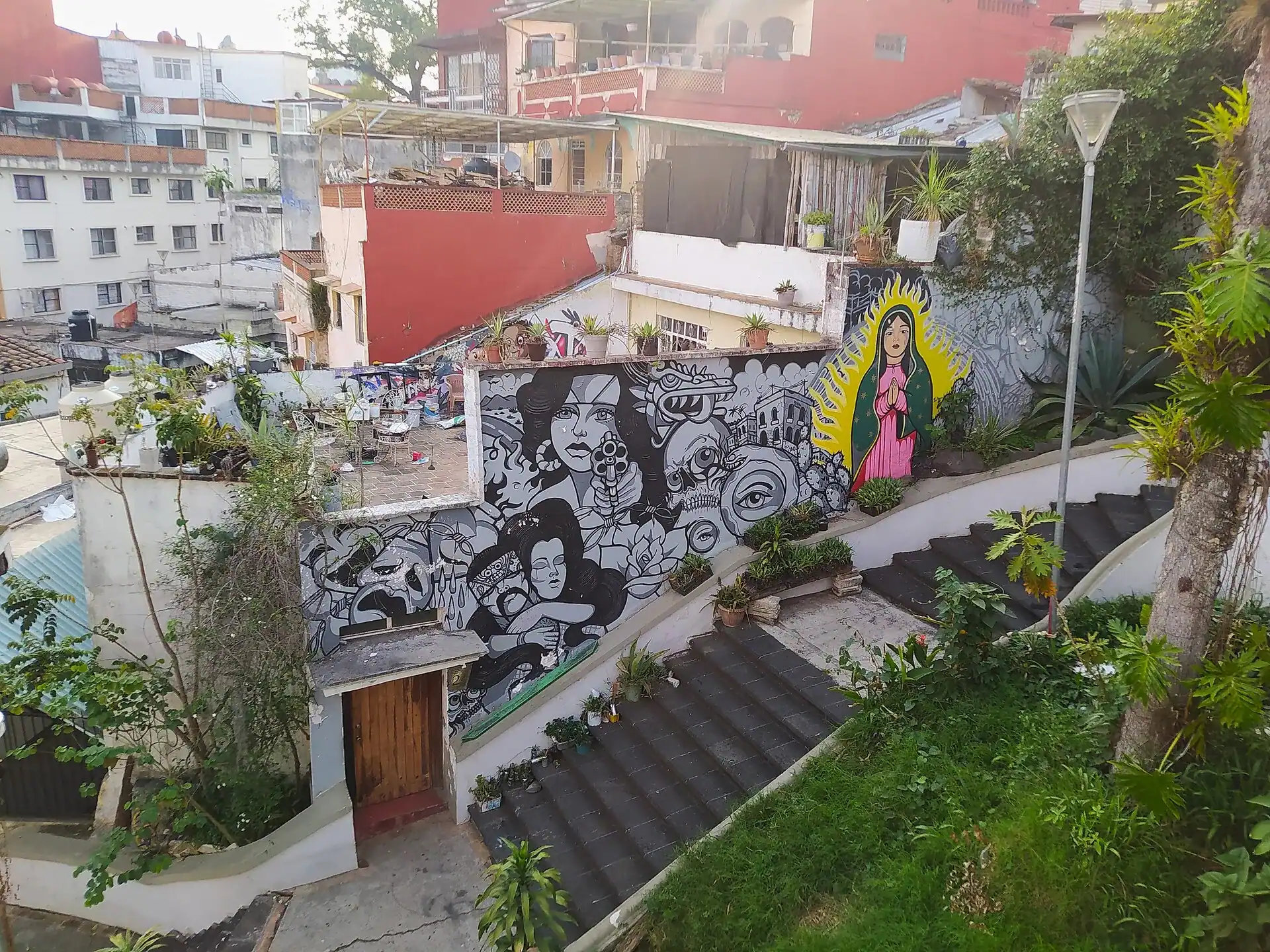 A painted wall in Xalapa above the rooftops