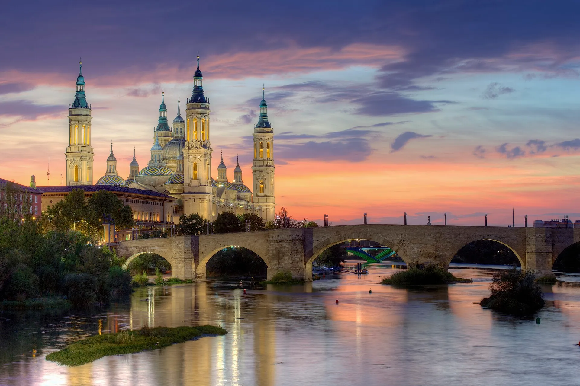 Basilica of Our Lady of the Pillar and Puente de Piedra over the Ebro River at dusk, Zaragoza