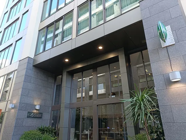Adina Apartment Hotel Auckland Britomart entrance with Adina signage, Britomart district