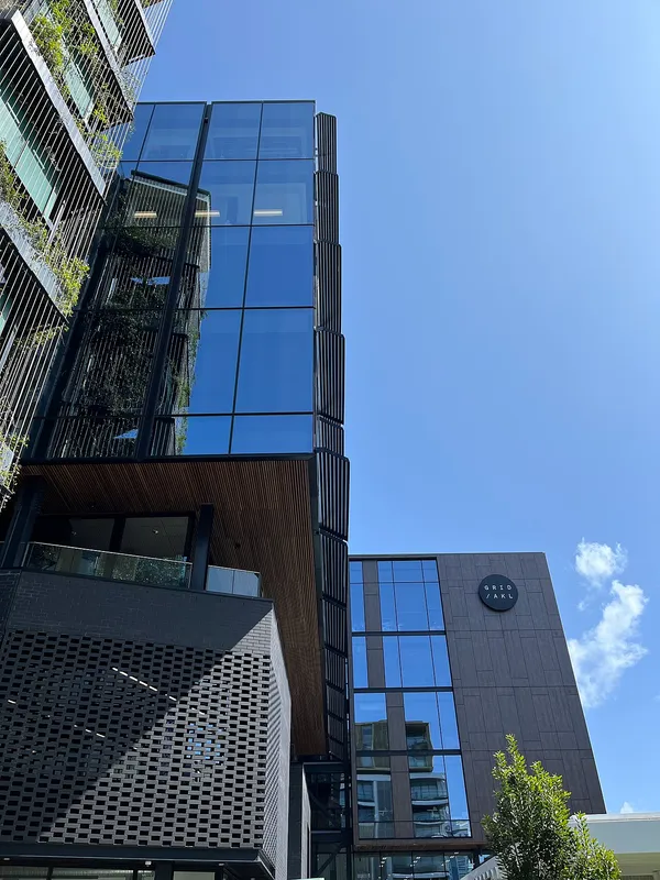 GridAKL building exterior in Wynyard Quarter, Auckland, showing the GRID/AKL logo on the facade
