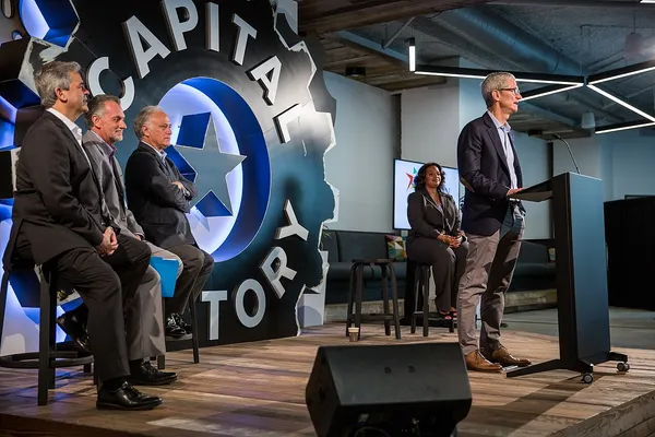 Interior of Capital Factory coworking space in Austin, with large branded logo on wall