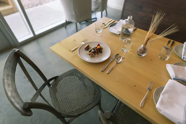 Dining table setting at Emmer and Rye farm-to-table restaurant in Austin