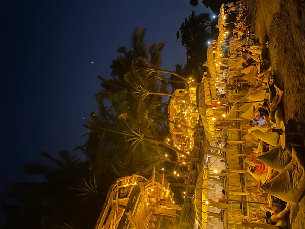 La Brisa beach club at night, bamboo structures with fairy lights on Echo Beach, Canggu