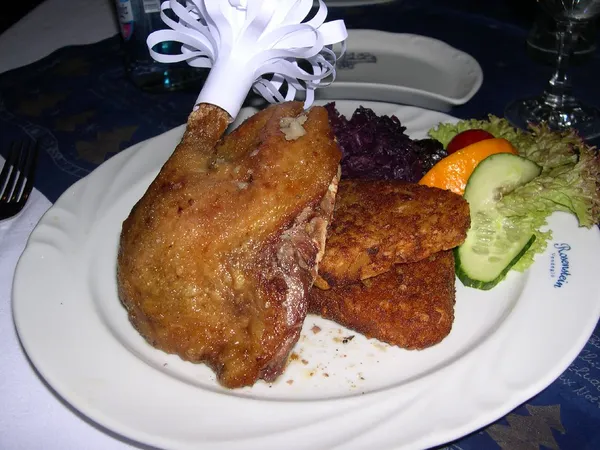 Duck dish served at Rosenstein Vendeglo, Budapest, with branded plate