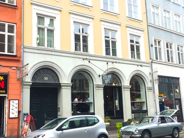 Atelier September cafe exterior at Gothersgade 30 Copenhagen, arched windows with signage
