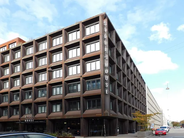Steel House Copenhagen exterior, rust-steel corten facade with large STEEL HOUSE signage on Nyropsgade