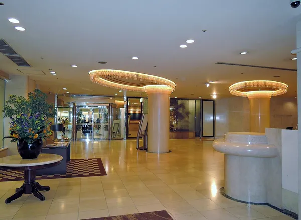 Lobby interior of Solaria Nishitetsu Hotel Fukuoka with chandelier lighting and marble reception
