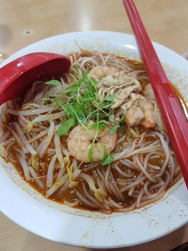 A bowl of Sarawak laksa with prawns and rice vermicelli from Chong Choon Cafe, Kuching