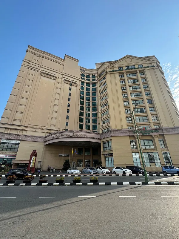 Exterior of the Imperial Riverbank Hotel in Kuching, showing the grand neoclassical-style building facade