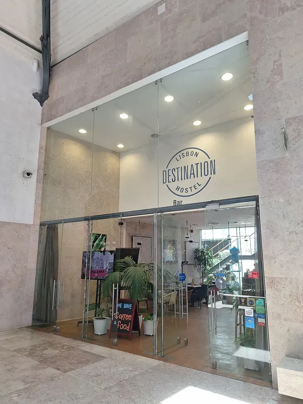 Lisbon Destination Hostel entrance with logo visible at Rossio station