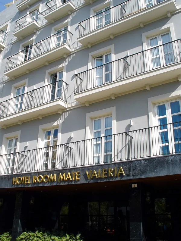 Facade of Hotel Room Mate Valeria in Málaga with gold signage