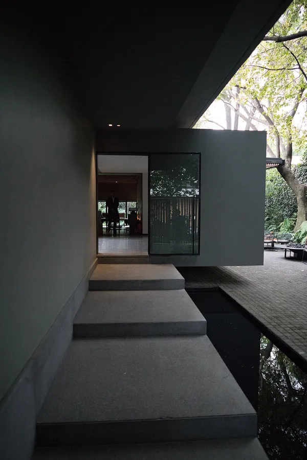 Minimalist entrance corridor of Pujol restaurant with reflecting pool, Polanco, Mexico City