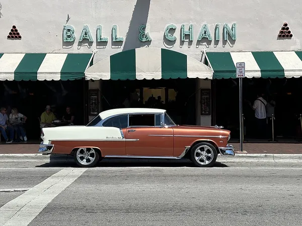 Ball and Chain bar exterior on Calle Ocho, Little Havana, with antique Chevrolet Bel Air parked in front