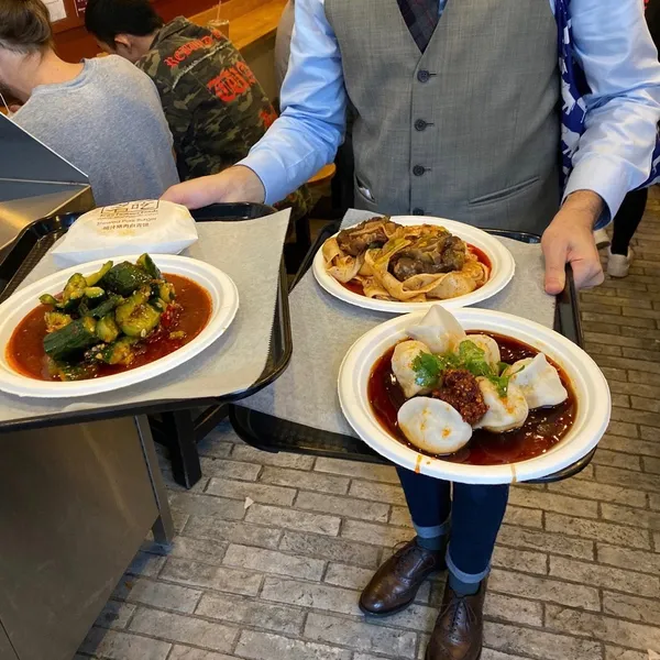 Food feast on trays at Xi'an Famous Foods in the East Village, New York