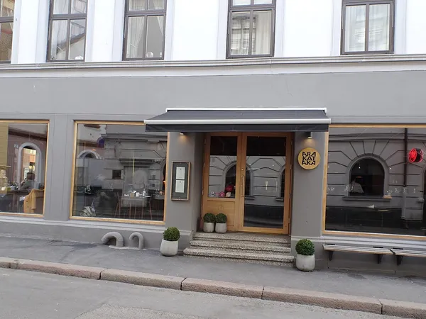 Storefront facade of Arakataka restaurant with sign in Oslo