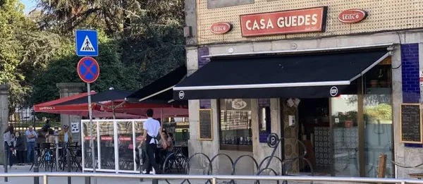 Exterior of Casa Guedes Tradicional restaurant in Porto with signage above the entrance