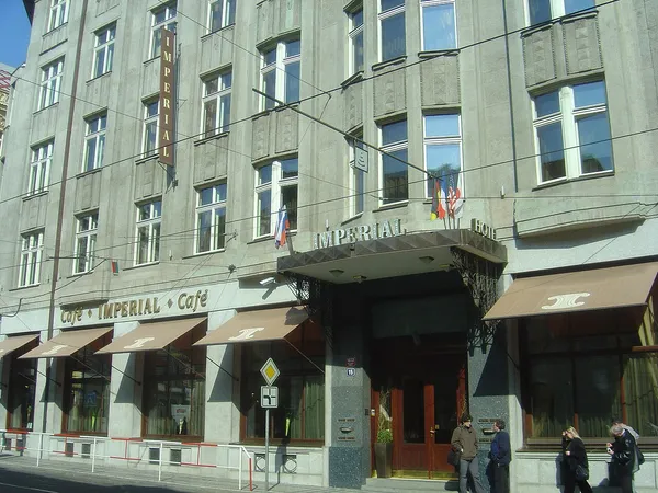 Exterior of Café Imperial Prague showing the Art Deco building facade with Café Imperial signage