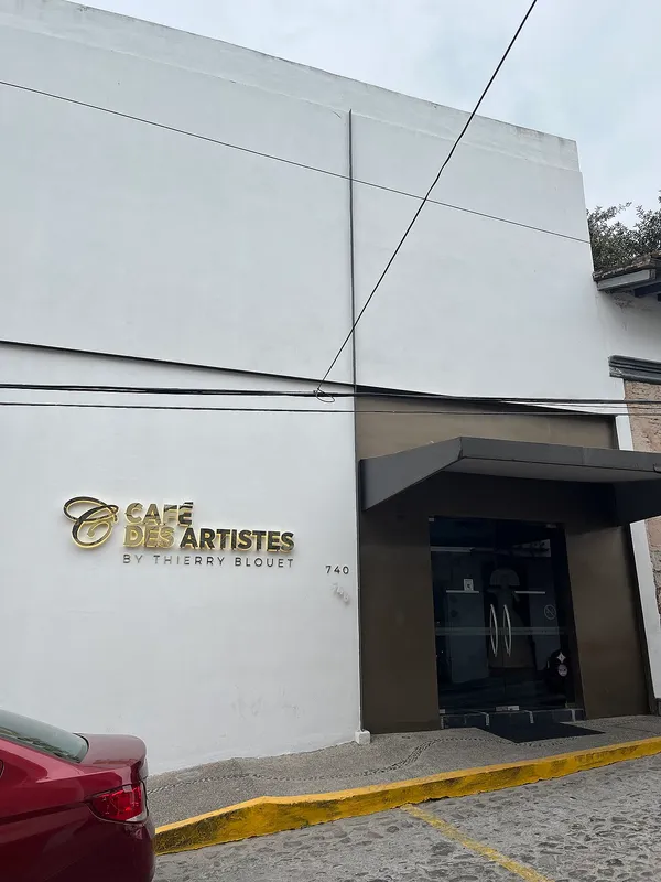 Cafe des Artistes by Thierry Blouet exterior facade with gold signage, Puerto Vallarta