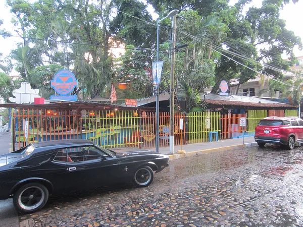 Margarita Grill exterior with blue neon sign and colorful fencing, Zona Romantica Puerto Vallarta