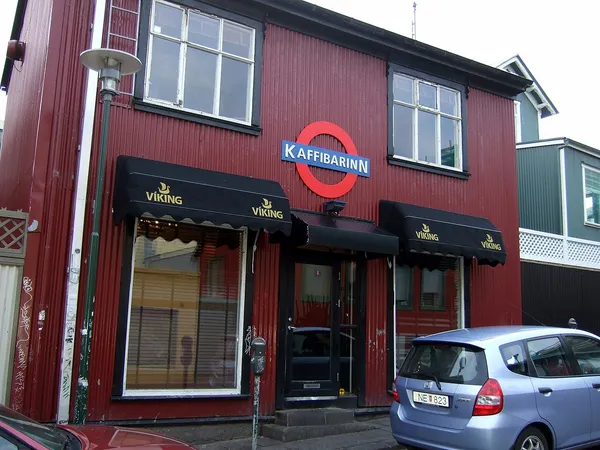 Kaffibarinn bar exterior in Reykjavik, red building with iconic roundel sign