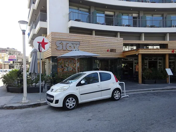 STAY Hotel signboard on the building facade in Gavriil Charitou Square, Rhodes New Town