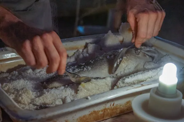 Salt-baked fish being carved tableside at Restaurant Dvor, Split