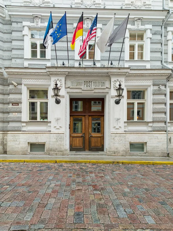 Entrance of Hotel Telegraaf in Tallinn Old Town showing the historic TELEGRAAF POST TELEFON inscription