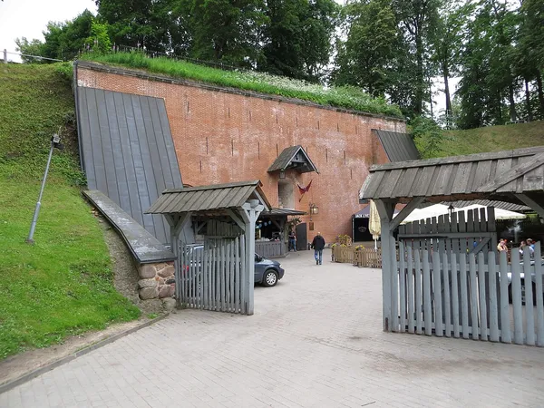 Entrance gate to Püssirohukelder beer restaurant, set into historic brick fortification in Tartu