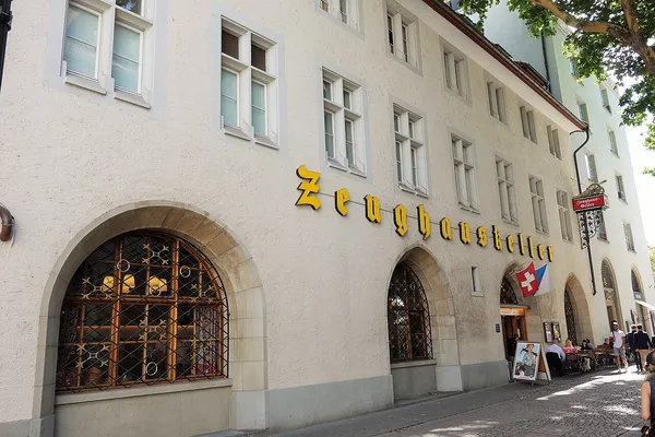 Zeughauskeller restaurant entrance with gothic gold lettering and Swiss flag, Zurich
